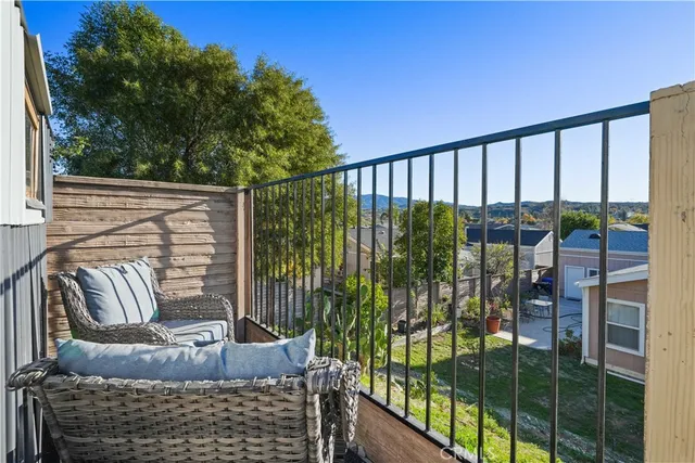 a view of balcony with furniture