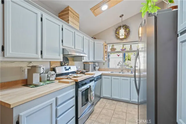 a kitchen with cabinets and window