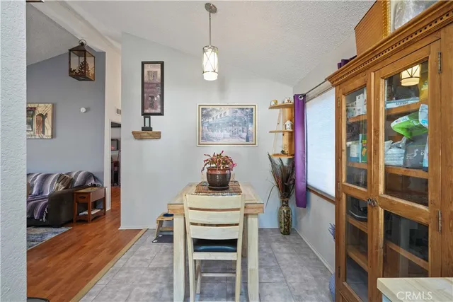 a view of a livingroom with furniture and a window