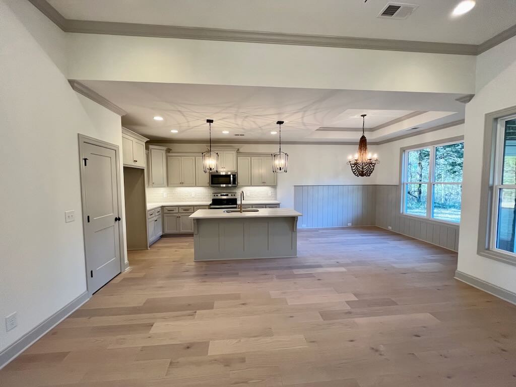 4618 McCrary Road Lebanon, TN 37090 - Photo 7 of 16 a large kitchen with kitchen island a sink stainless steel appliances and cabinets