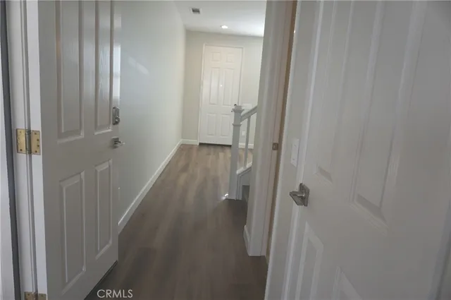 a view of a bathroom from the hallway