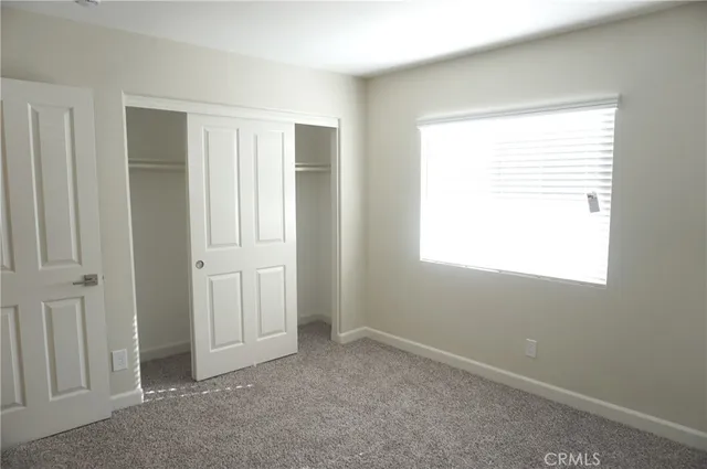 a bathroom with a sink a toilet and a large mirror