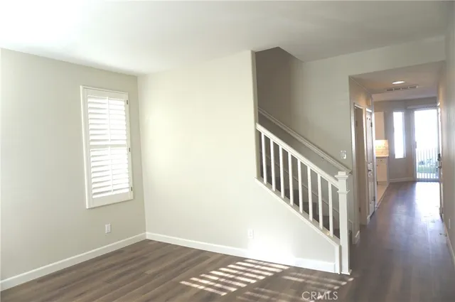 a view of an entryway with wooden floor