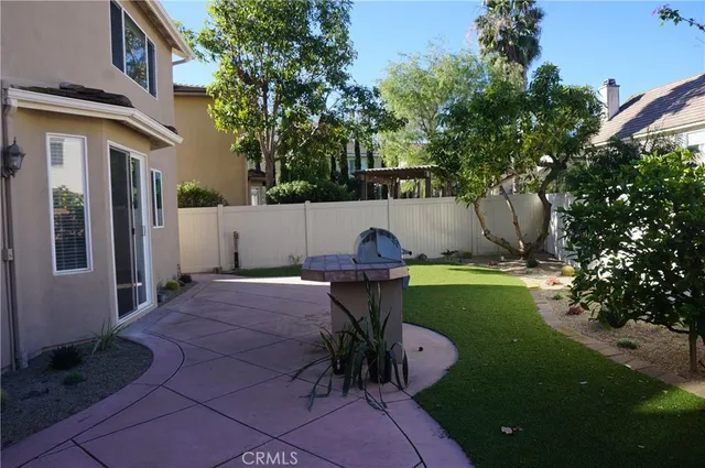 a front view of a house with outdoor seating