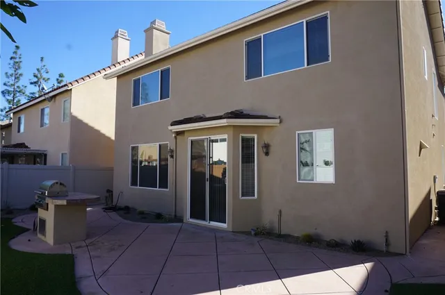 a view of a backyard with sitting area