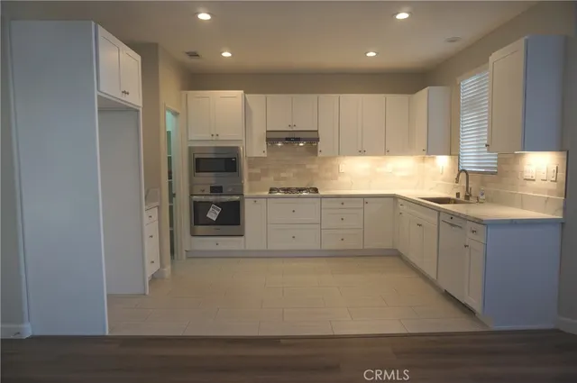 a large kitchen with cabinets