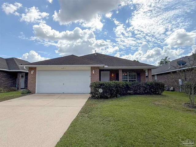 a view of a yard in front of a house