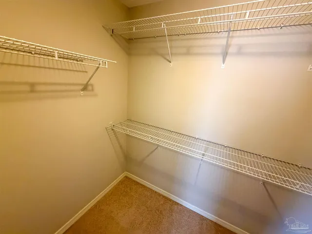a view of a room with racks on the wall