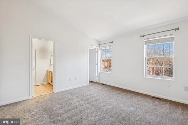 a picture of a bench in front of a wall