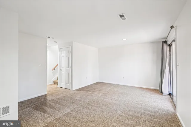 a picture of a bench in front of a wall