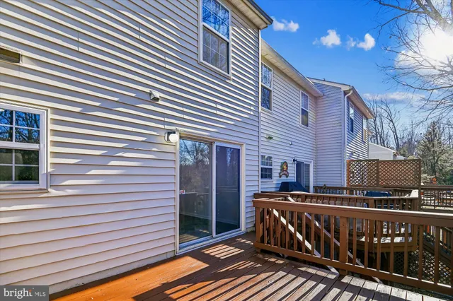 a picture of a bench in front of a wall