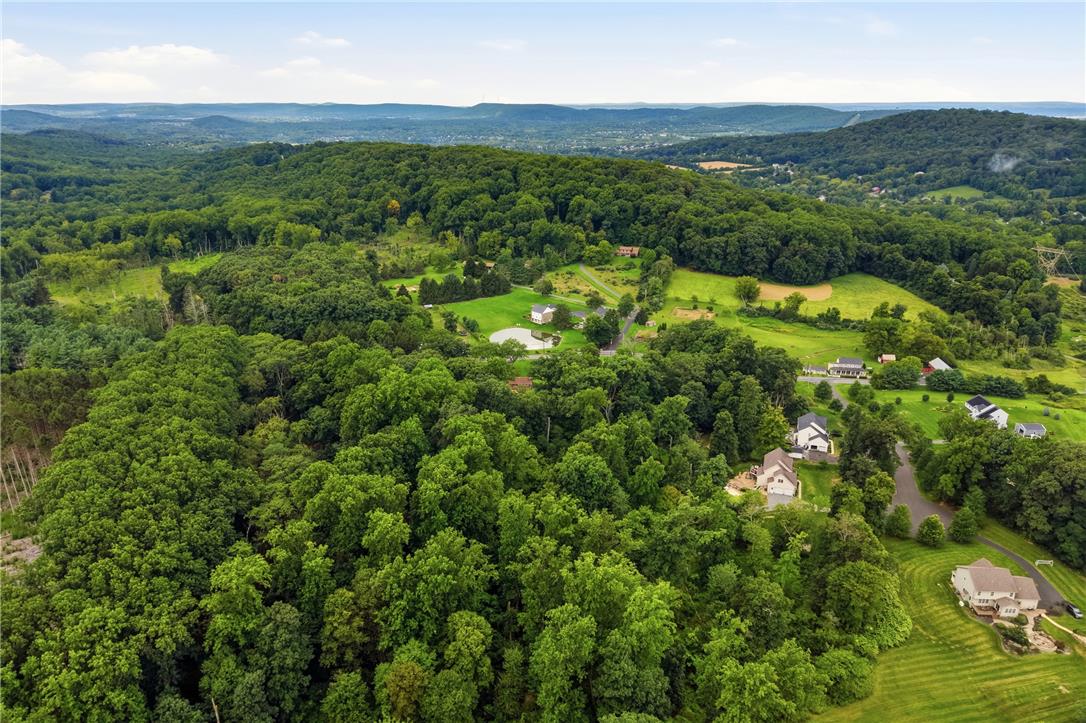 3573 Lower Saucon Road Hellertown, PA 18055 - Photo 53 of 56 An aerial perspective showcases a lush forested landscape stretching toward distant mountain ridges.