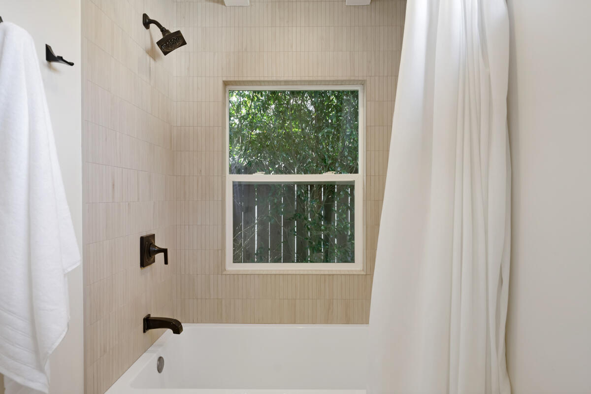 2214 Channing Way Santa Barbara, CA 93109 - Photo 15 of 44 a bathroom with a window and a bathtub