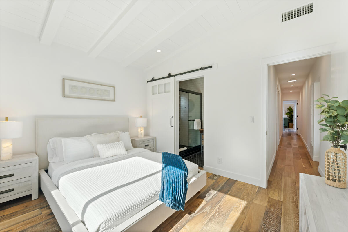 2214 Channing Way Santa Barbara, CA 93109 - Photo 17 of 44 a bedroom with a bed and wooden floor