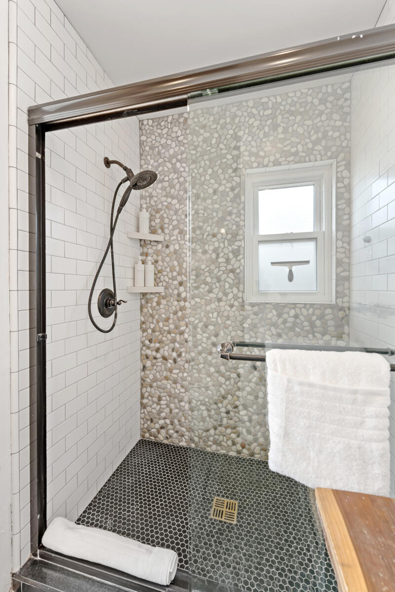 2214 Channing Way Santa Barbara, CA 93109 - Photo 19 of 44 a bathroom with a glass door shower