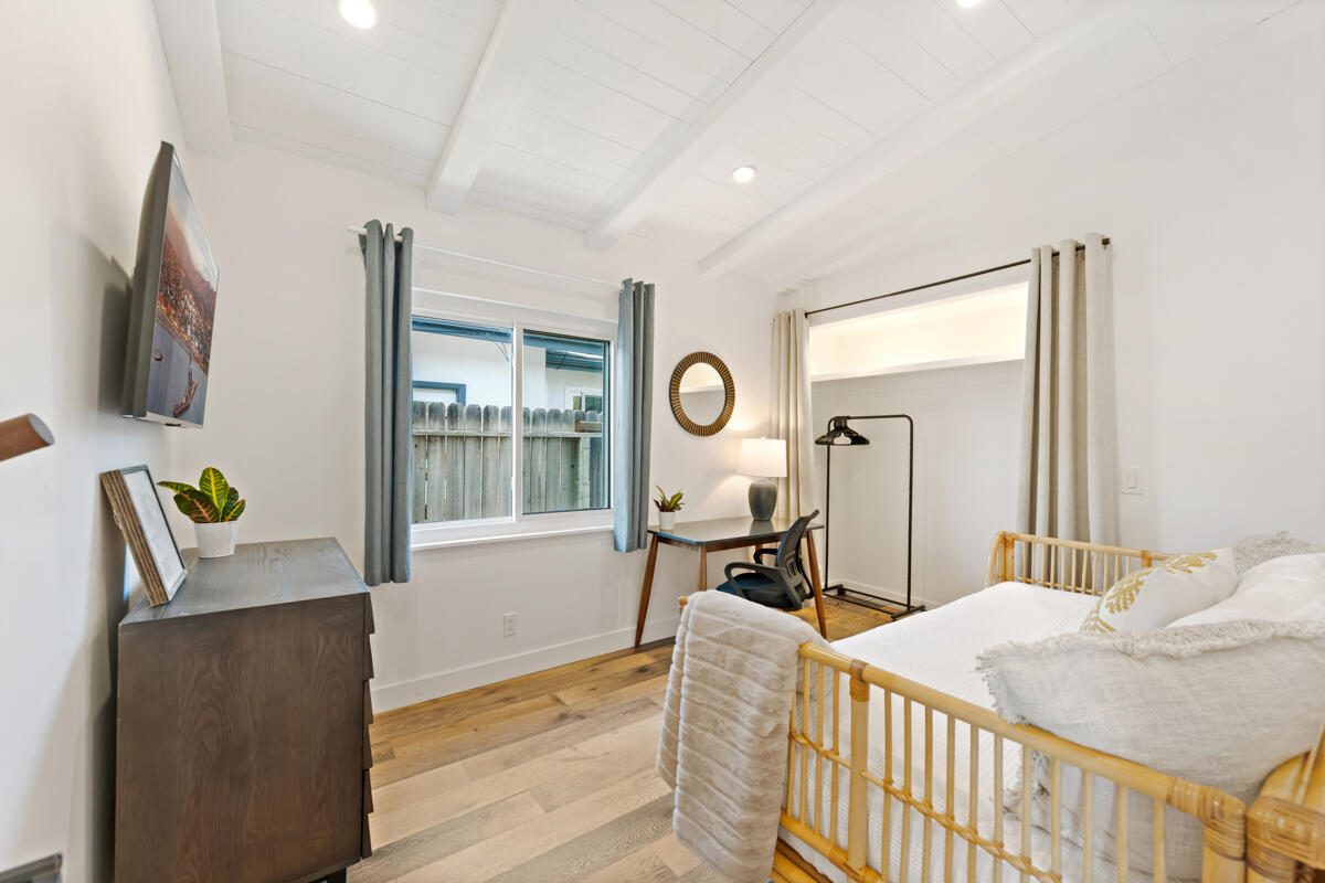 2214 Channing Way Santa Barbara, CA 93109 - Photo 21 of 44 a bedroom with furniture and a wooden floor