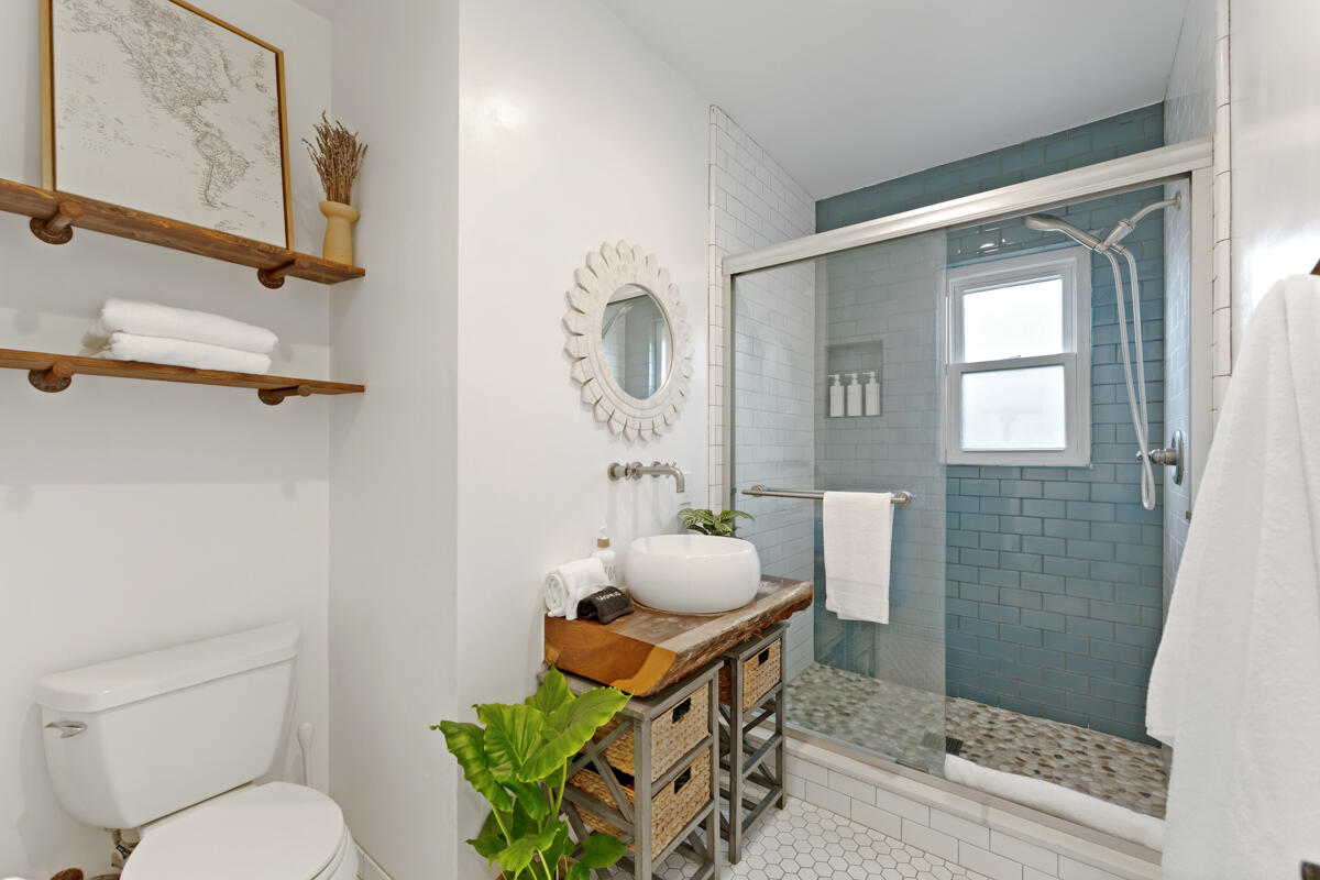 2214 Channing Way Santa Barbara, CA 93109 - Photo 23 of 44 a bathroom with a toilet a sink and a shower