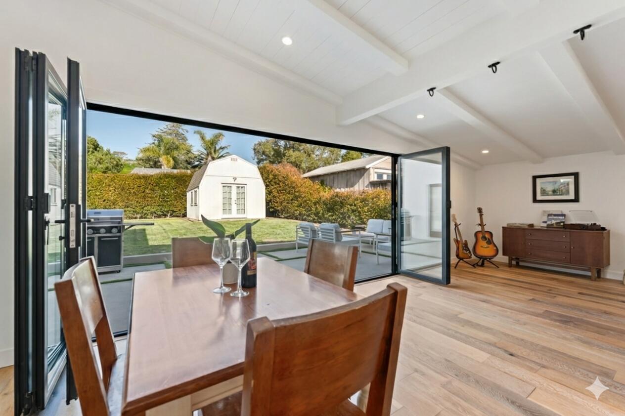 2214 Channing Way Santa Barbara, CA 93109 - Photo 30 of 44 a living room with furniture a flat screen tv and floor to ceiling window