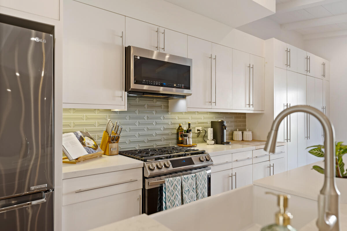 2214 Channing Way Santa Barbara, CA 93109 - Photo 5 of 44 a kitchen with stainless steel appliances a stove a sink a microwave and cabinets
