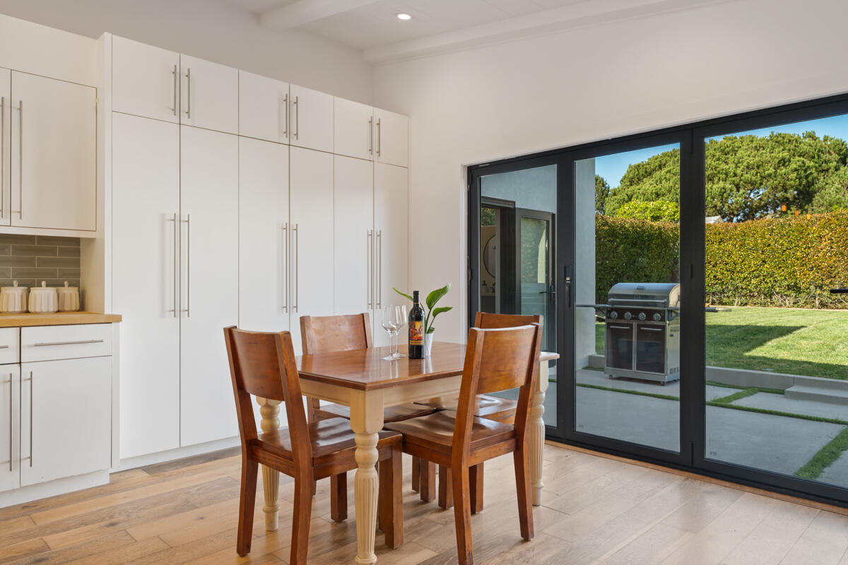 2214 Channing Way Santa Barbara, CA 93109 - Photo 8 of 44 a view of a dining room with furniture large windows and wooden floor