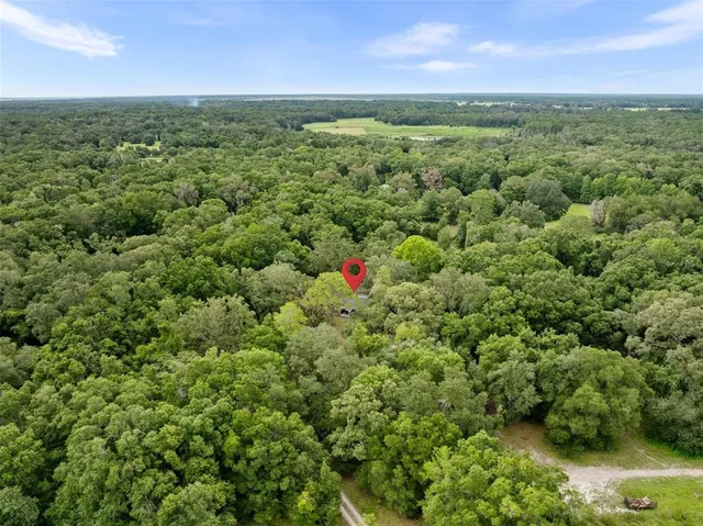 a view of a field with an outdoor space