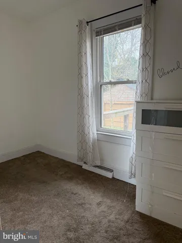 a view of a room that has a window in it