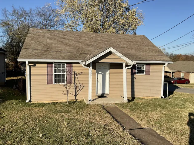 a house with trees in the background