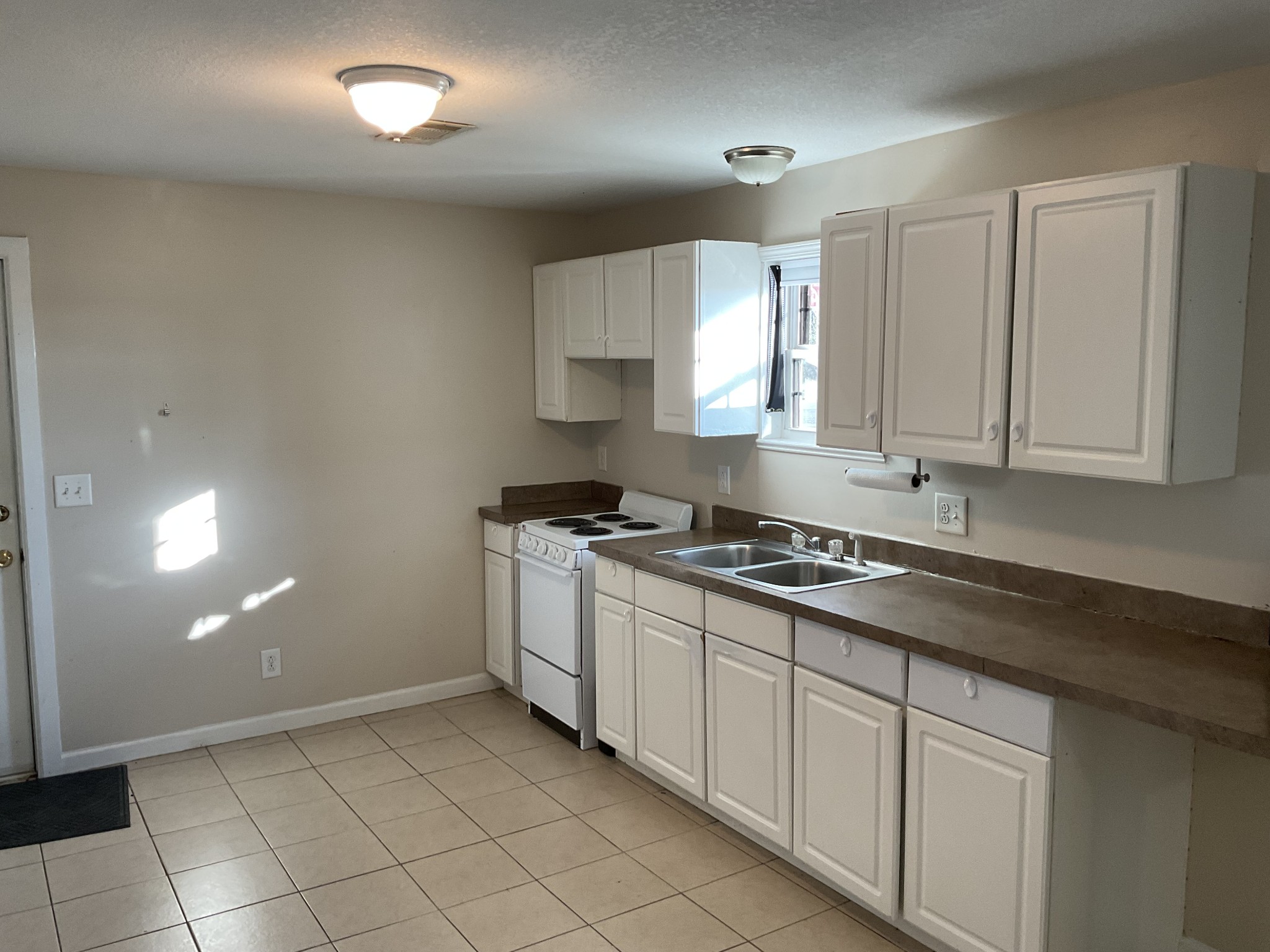 811 East 17th Avenue Springfield, TN 37172 - Photo 7 of 20 a kitchen with cabinets appliances a sink and a stove top oven