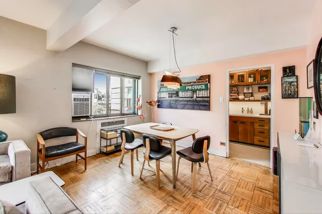 a view of a livingroom with furniture and window