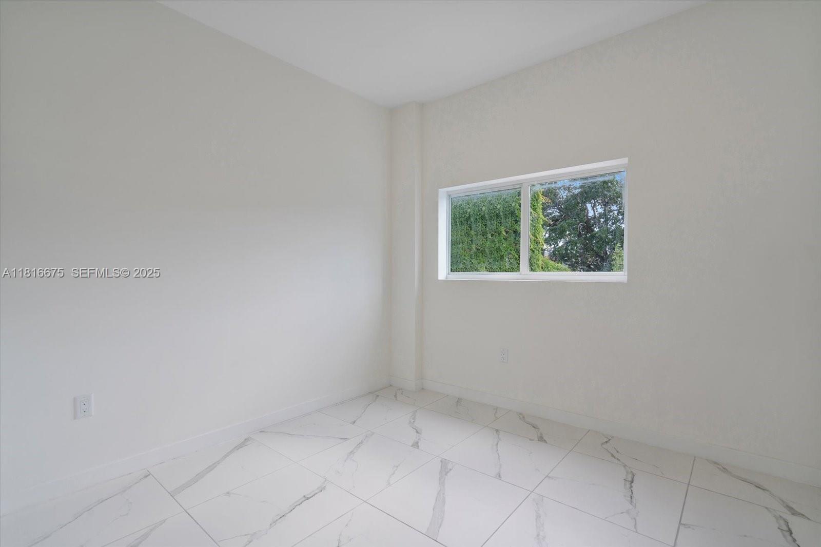 420 Southwest 7th Avenue, Unit 301 Miami, FL 33130 - Photo 9 of 19 an empty room with windows