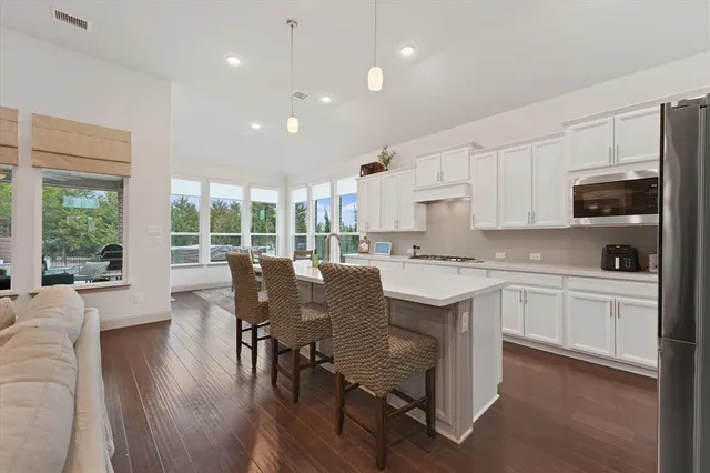 a bedroom with a bed and a potted plant