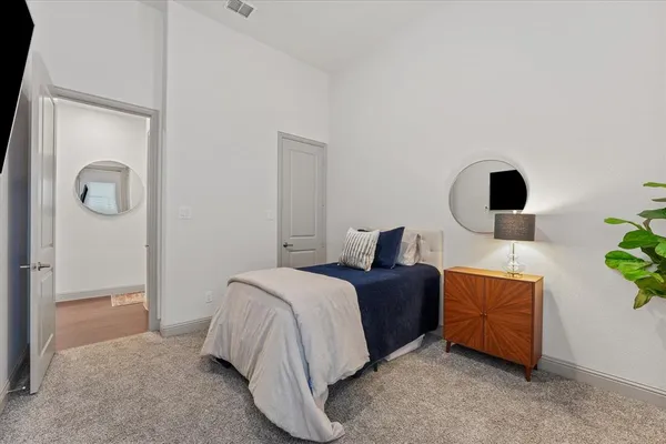 a bed room with a bed and a window