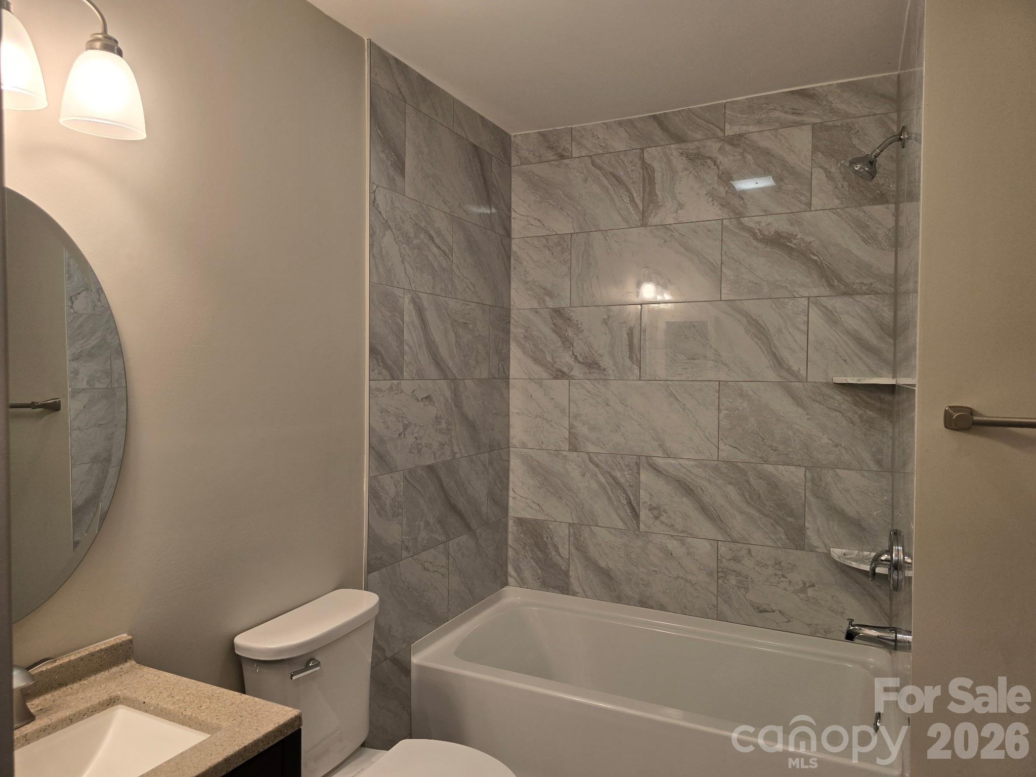 126 Sunset Drive Chester, SC 29706 - Photo 15 of 31 a bathroom with a bathtub and a toilet