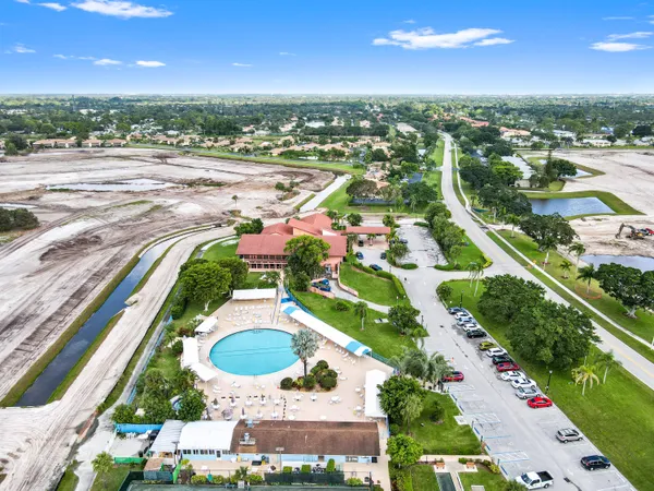 an aerial view of residential houses with outdoor space and street view
