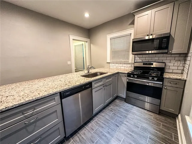 a bedroom with a table and chairs