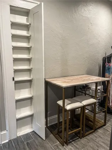 a kitchen with a sink stove top oven and cabinets