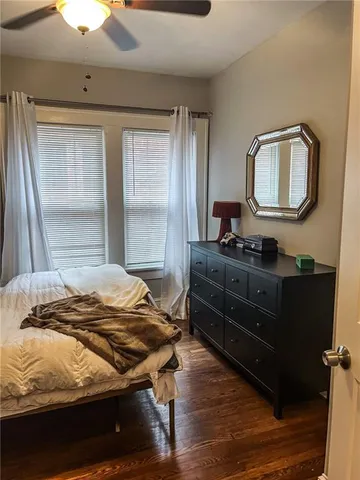 a bedroom with a bed and window