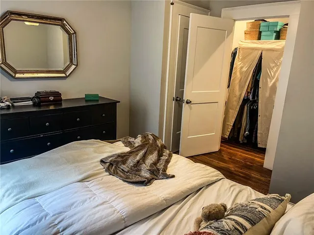 a living room with furniture and a large mirror