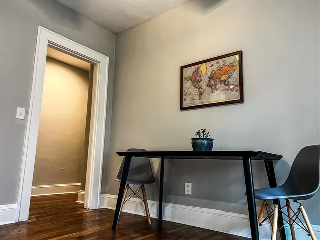 a kitchen with granite countertop a stove top oven microwave and cabinets