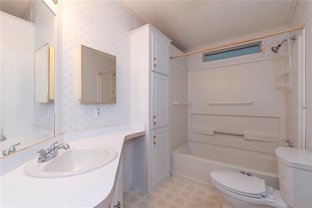 1001 Starkey Road, Unit 767 Largo, FL 33771 - Photo 12 of 41 a bathroom with a sink toilet and shower