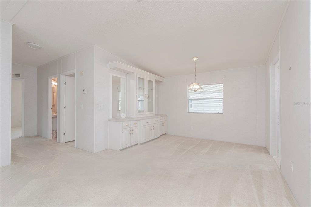 1001 Starkey Road, Unit 767 Largo, FL 33771 - Photo 13 of 41 an empty room with windows and closet