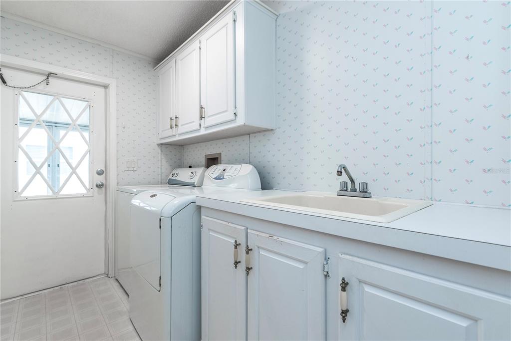 1001 Starkey Road, Unit 767 Largo, FL 33771 - Photo 17 of 41 a bathroom with a sink and cabinets