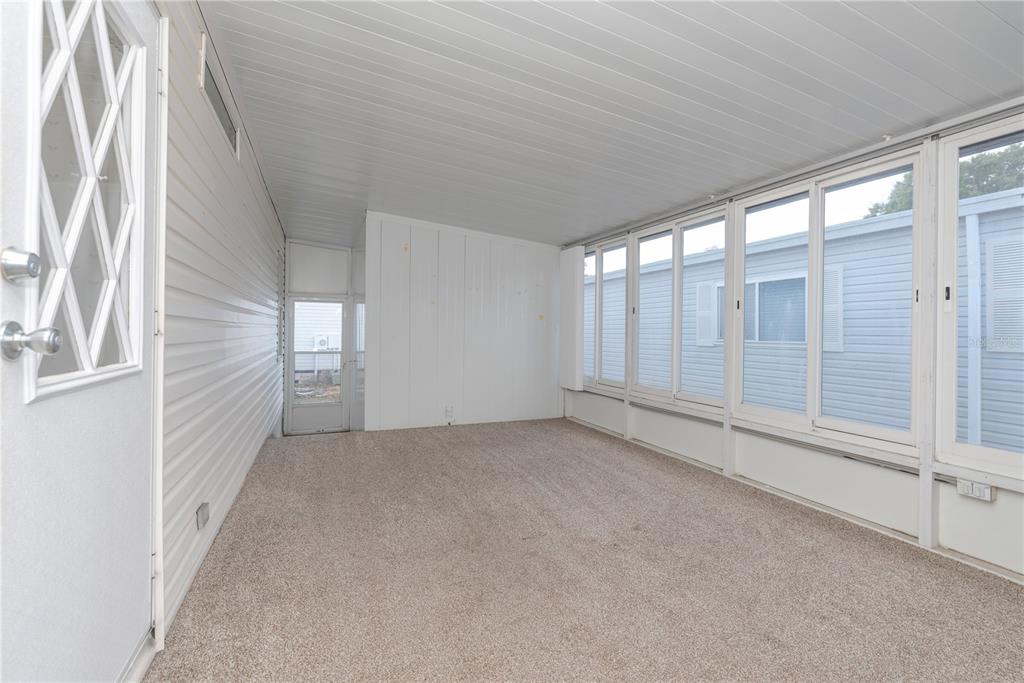 1001 Starkey Road, Unit 767 Largo, FL 33771 - Photo 18 of 41 an empty room with windows