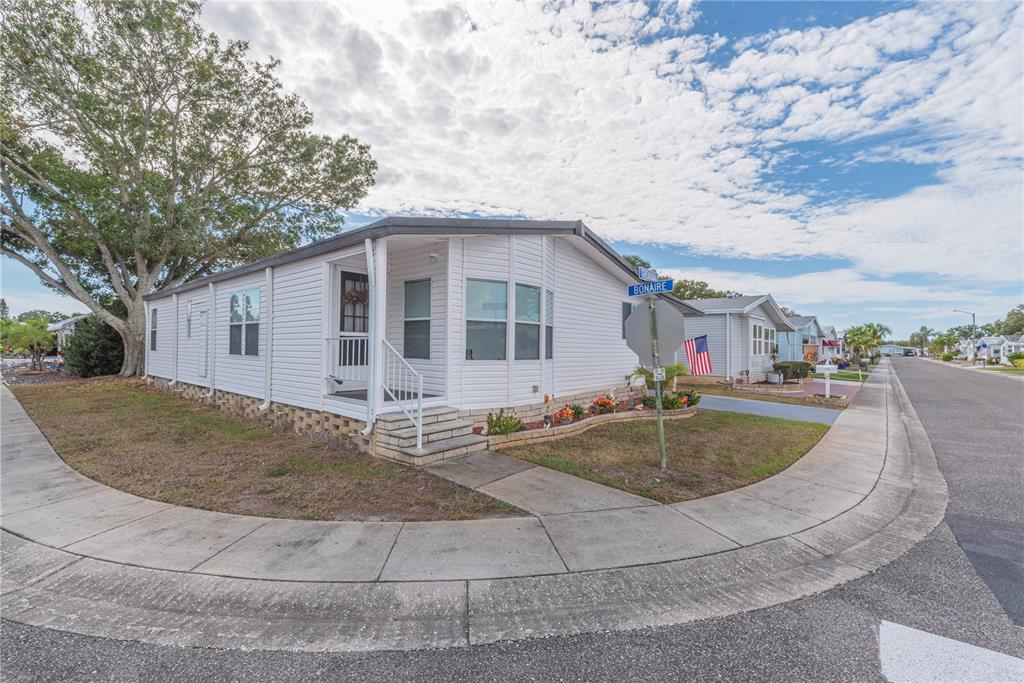 1001 Starkey Road, Unit 767 Largo, FL 33771 - Photo 22 of 41 a view of a house with swimming pool and sitting area