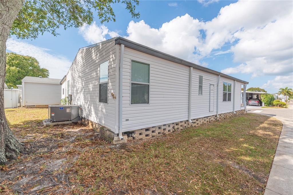 1001 Starkey Road, Unit 767 Largo, FL 33771 - Photo 23 of 41 a view of a house with backyard and sitting area