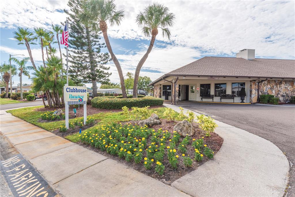 1001 Starkey Road, Unit 767 Largo, FL 33771 - Photo 24 of 41 a view of a house with a yard and potted plants