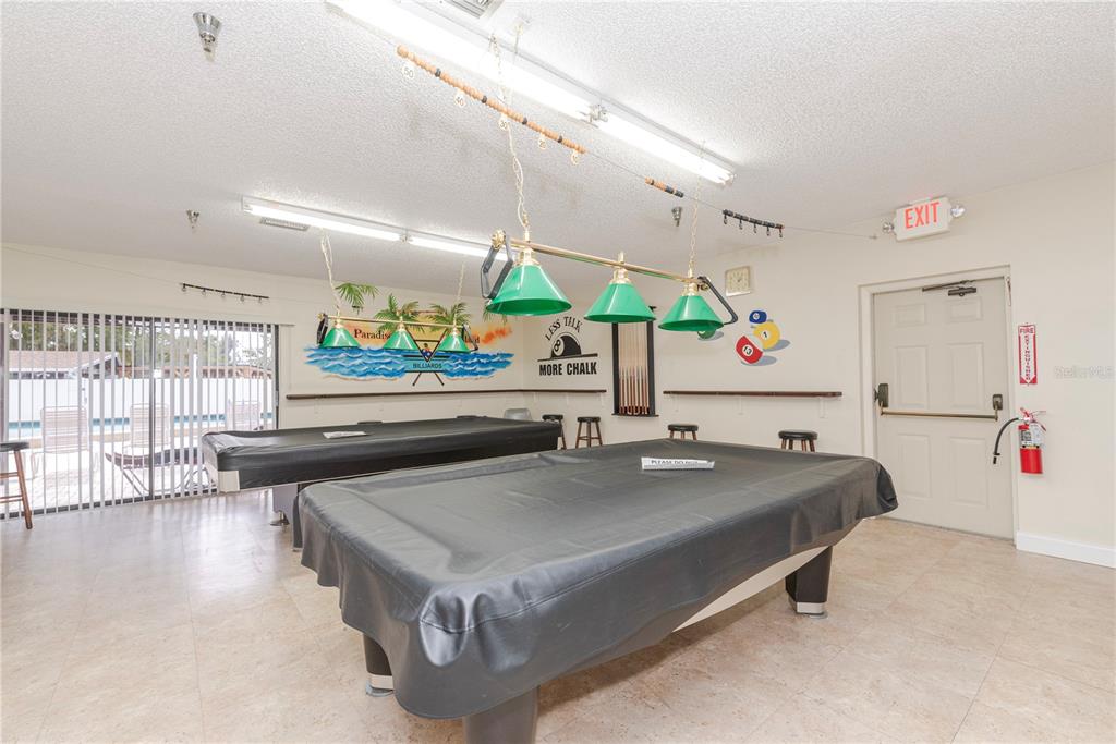 1001 Starkey Road, Unit 767 Largo, FL 33771 - Photo 26 of 41 a living room with stainless steel appliances furniture and a large window