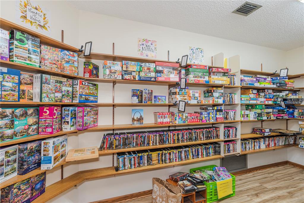1001 Starkey Road, Unit 767 Largo, FL 33771 - Photo 28 of 41 a room with lots of furniture and toys