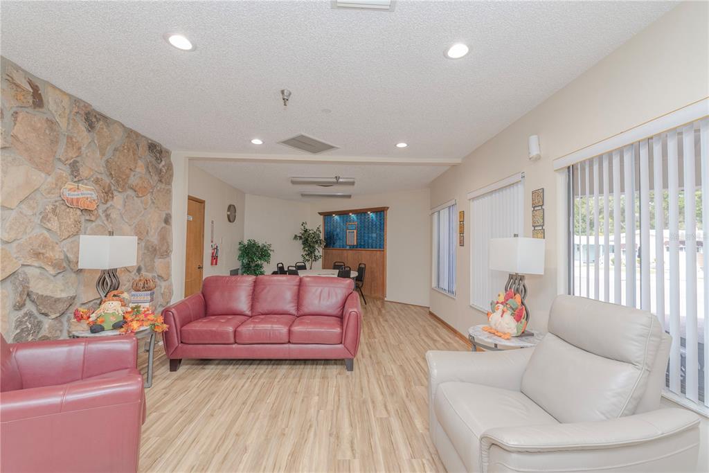 1001 Starkey Road, Unit 767 Largo, FL 33771 - Photo 29 of 41 a living room with furniture and a large window