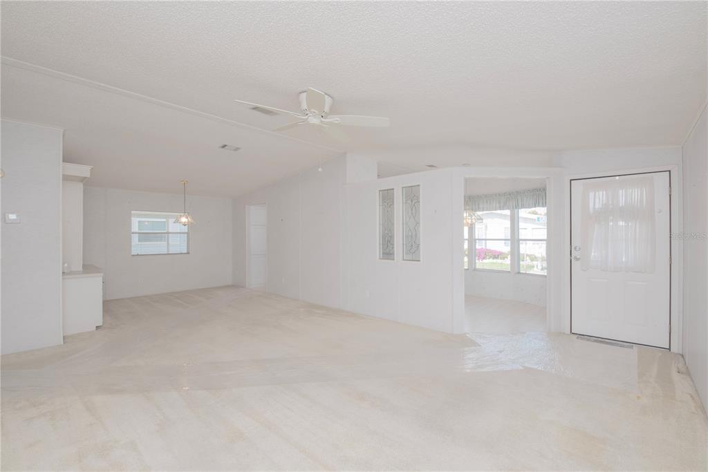 1001 Starkey Road, Unit 767 Largo, FL 33771 - Photo 3 of 41 an empty room with windows and closet